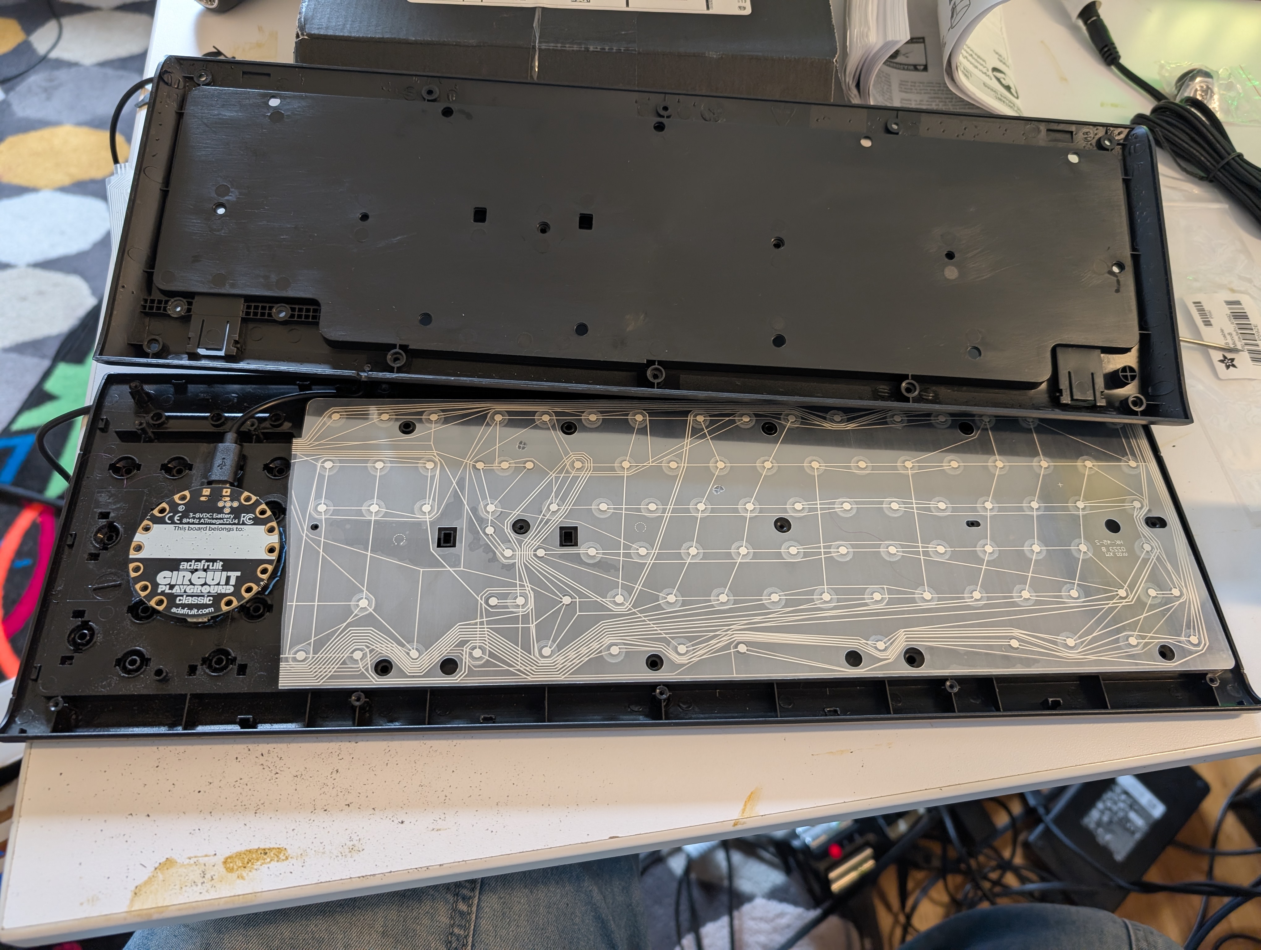 Photo of opened keyboard, showing new circuitboard inside